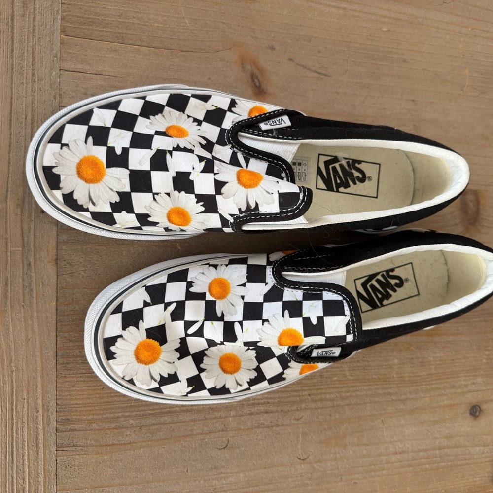 Vans Black and White Checkerboard Slip-Ons with Orange Daisies